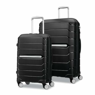 Two black hardshell suitcases with wheels and handles.