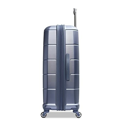 Side view of blue hard-shell suitcase with wheels and extended handle